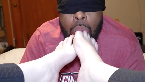 Amateur couple is in the kitchen with a red painted toe