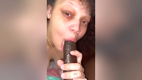 Amateur brunette milf giving blowjob to a big cock