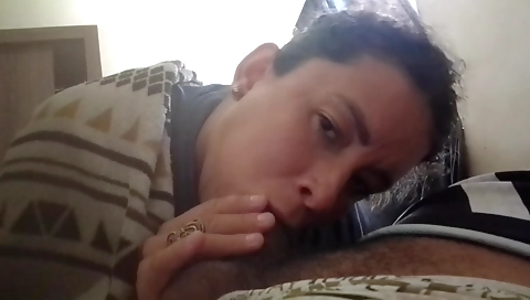 Ebony chick gives a blowjob in an interracial scene